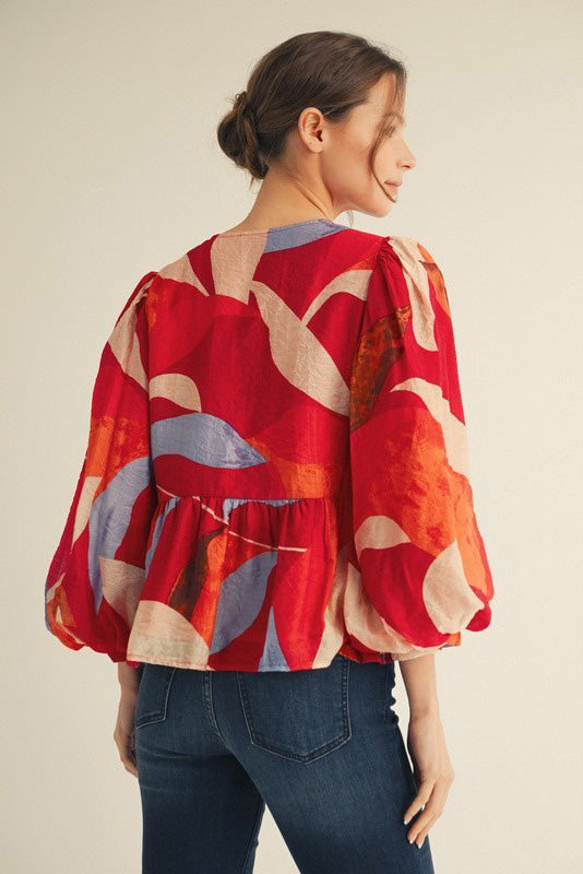 Abstract Peplum Blouse with Tie Front