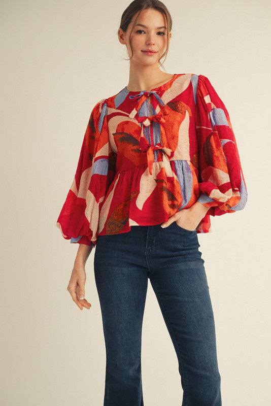 Abstract Peplum Blouse with Tie Front
